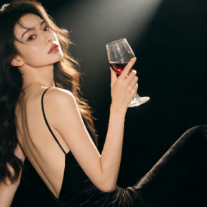KL Escort Girl Elegant woman in black dress holding red wine. Malaysia Escort Sex in Kuala Lumpur