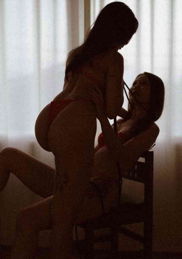 KL Escort Girl Silhouetted women in lingerie, intimate moment Malaysia Escort Sex in Kuala Lumpur