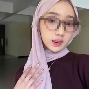 KL Escort Girl Woman in hijab and sunglasses sticking out tongue, showing manicured nails Malaysia Escort Sex in Kuala Lumpur