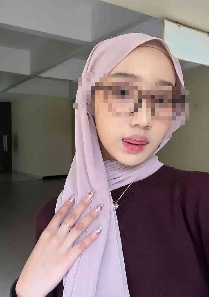 KL Escort Girl Woman in hijab and sunglasses sticking out tongue, showing manicured nails Malaysia Escort Sex in Kuala Lumpur