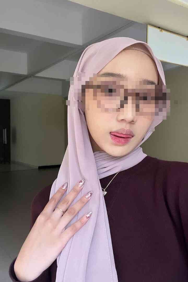 KL Escort Girl Woman in hijab and sunglasses sticking out tongue, showing manicured nails Malaysia Escort Sex in Kuala Lumpur