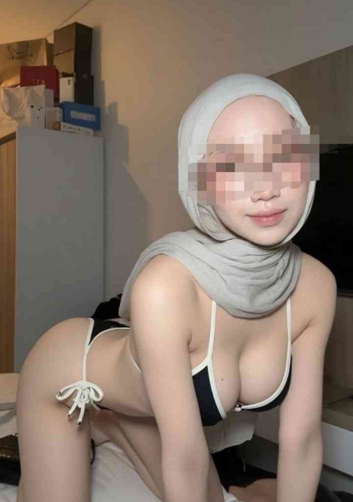 KL Escort Girl Young Malay woman in hijab and bikini poses provocatively. Malaysia Escort Sex in Kuala Lumpur